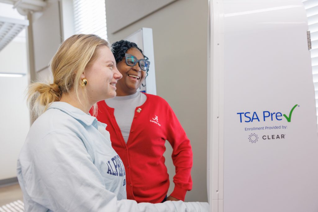 TSA Agent helping a customer get TSA PreCheck