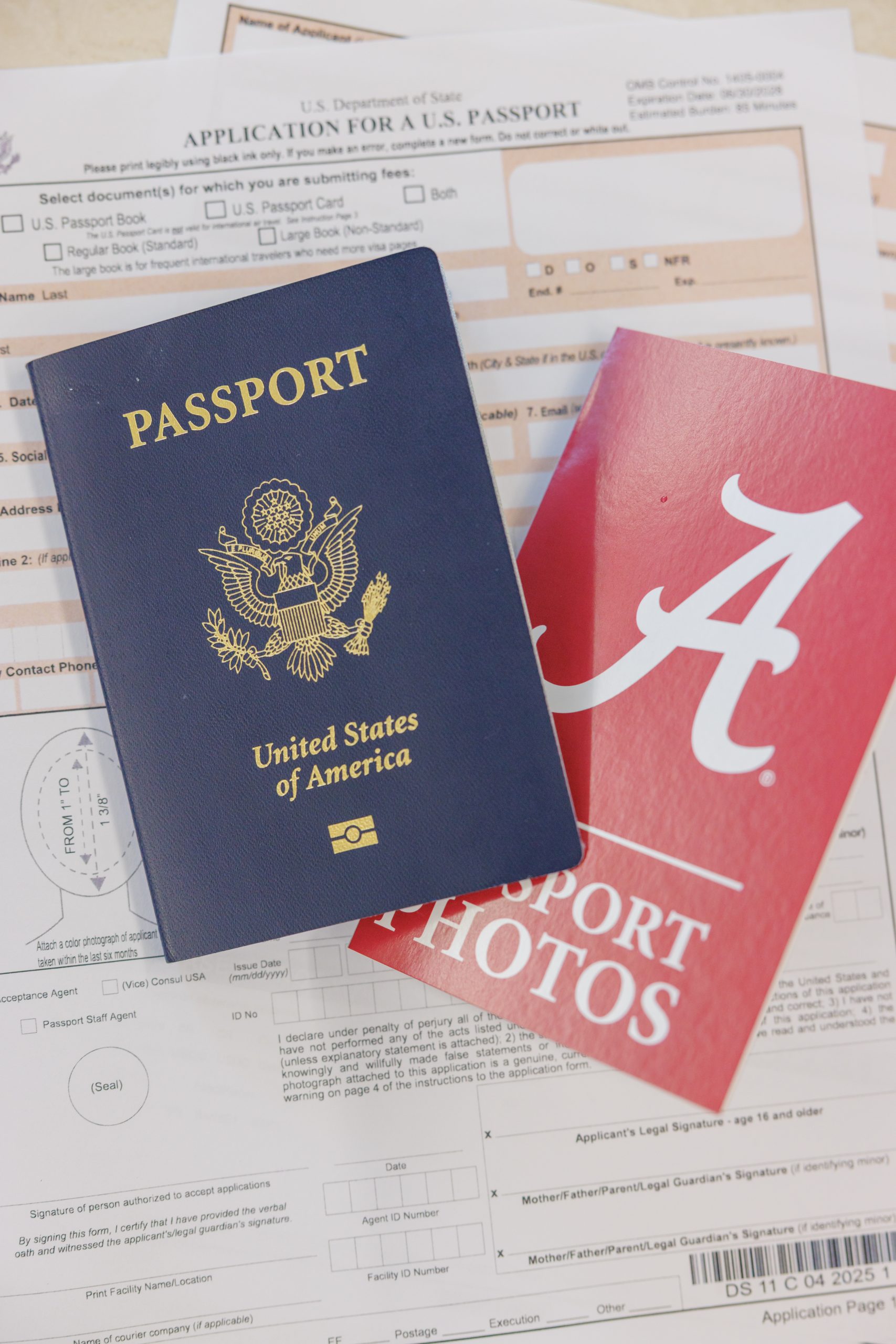Passport and Passport photo holder laying on a passport application
